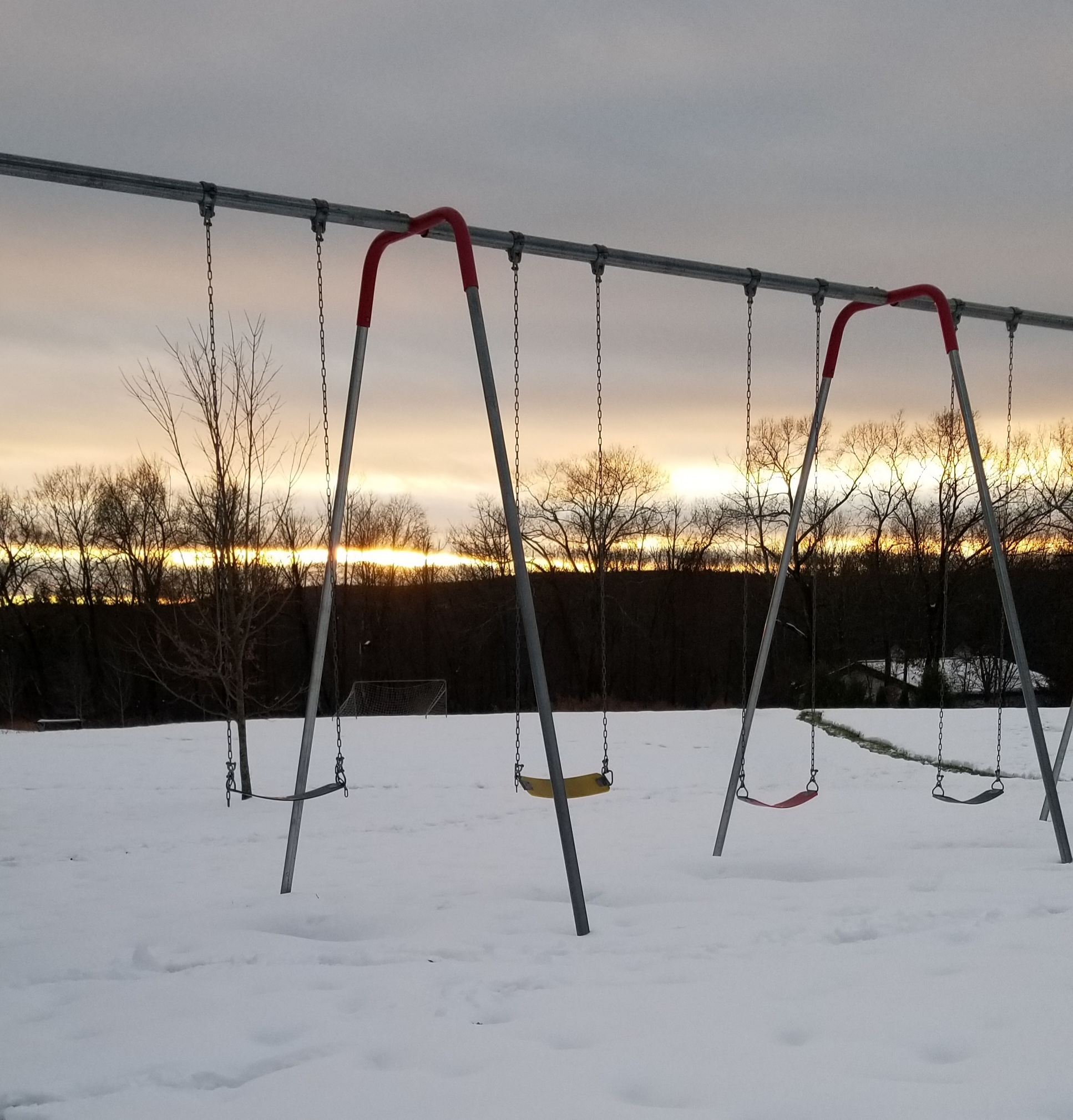 Snowy Playground at Sunset